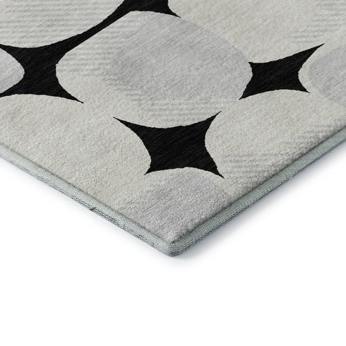 5' X 8' Black And Ivory Abstract Geometric Washable Area Rug With UV Protection