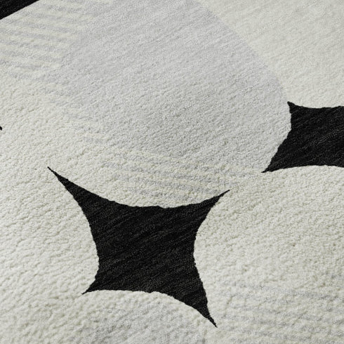 5' X 8' Black And Ivory Abstract Geometric Washable Area Rug With UV Protection