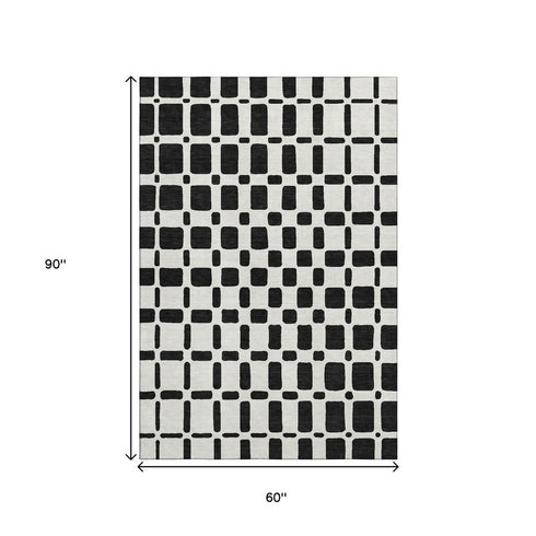 5' X 8' Black And Ivory Geometric Washable Area Rug With UV Protection