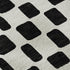 8' Black And Ivory Geometric Washable Round Rug With UV Protection