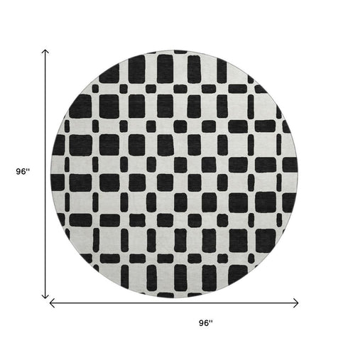 8' Black And Ivory Geometric Washable Round Rug With UV Protection