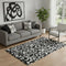 5' X 8' Black And Ivory Floral Washable Area Rug With UV Protection