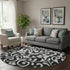 8' Black And Ivory Floral Washable Round Rug With UV Protection