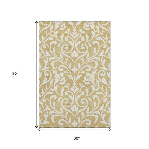 5' X 8' Gold And Ivory Floral Washable Area Rug With UV Protection
