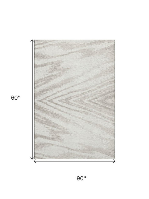 5' X 8' Ivory And Beige Abstract Washable Area Rug With UV Protection