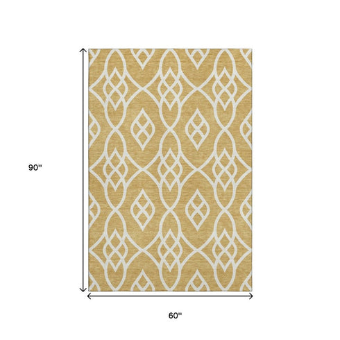 5' X 8' Gold And Ivory Trellis Washable Area Rug With UV Protection
