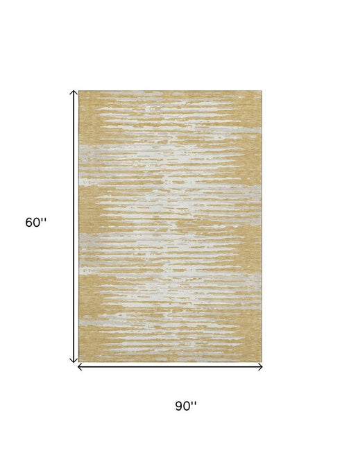 5' X 8' Gold And Ivory Striped Washable Area Rug With UV Protection