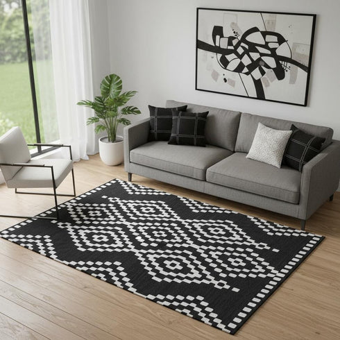 5' X 8' Black And Ivory Geometric Washable Area Rug With UV Protection