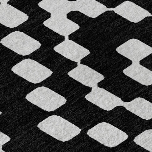5' X 8' Black And Ivory Geometric Washable Area Rug With UV Protection