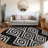 8' Black And Ivory Geometric Washable Round Rug With UV Protection