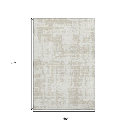 5' X 8' Ivory And Beige Abstract Washable Area Rug With UV Protection