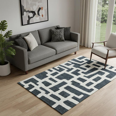 5' X 8' Black And Ivory Abstract Geometric Washable Area Rug With UV Protection