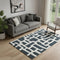 5' X 8' Black And Ivory Abstract Geometric Washable Area Rug With UV Protection