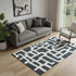 5' X 8' Black And Ivory Abstract Geometric Washable Area Rug With UV Protection