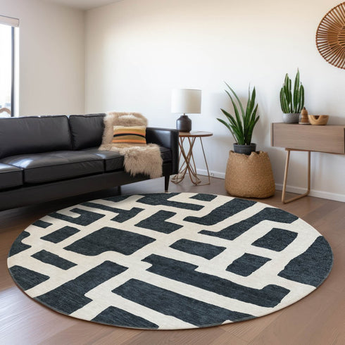 8' Black And Ivory Abstract Geometric Washable Round Rug With UV Protection