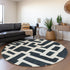 8' Black And Ivory Abstract Geometric Washable Round Rug With UV Protection