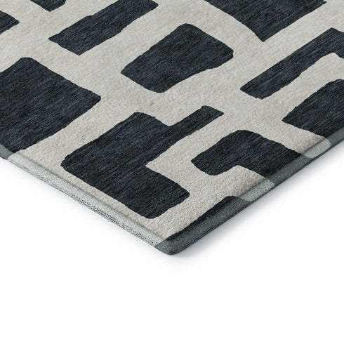8' Black And Ivory Abstract Geometric Washable Round Rug With UV Protection