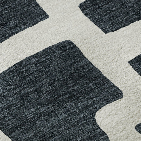 8' Black And Ivory Abstract Geometric Washable Round Rug With UV Protection