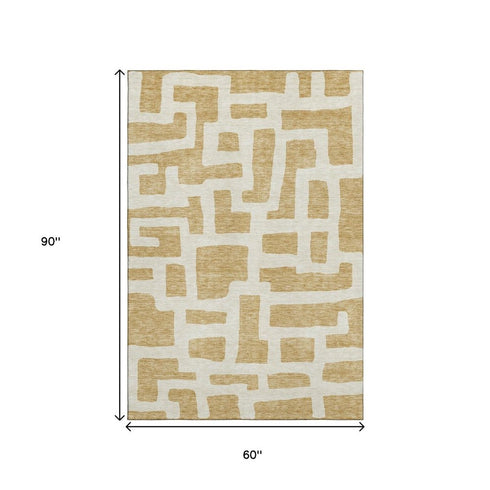 5' X 8' Gold And Ivory Abstract Geometric Washable Area Rug With UV Protection
