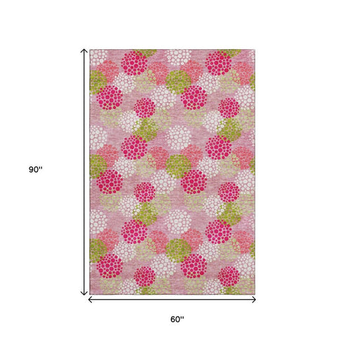 5' X 8' Pink Green And Ivory Polka Dot Washable Area Rug With UV Protection