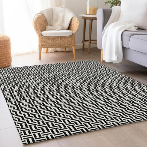 9' X 12' Black And Ivory Geometric Washable Area Rug With UV Protection