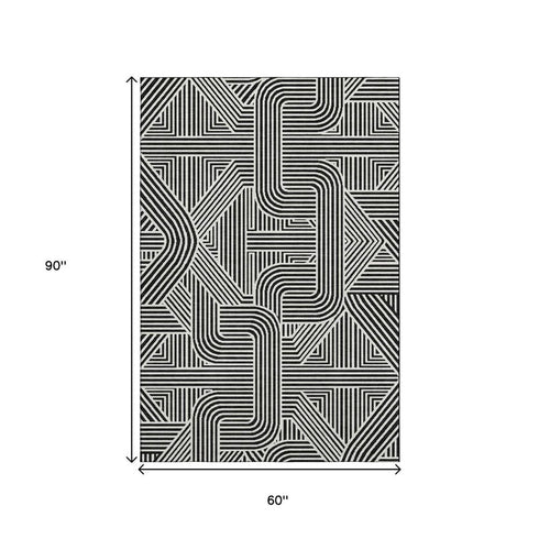 5' X 8' Black And Ivory Abstract Geometric Washable Area Rug With UV Protection