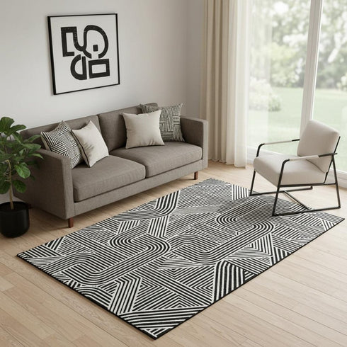 5' X 8' Black And Ivory Abstract Geometric Washable Area Rug With UV Protection