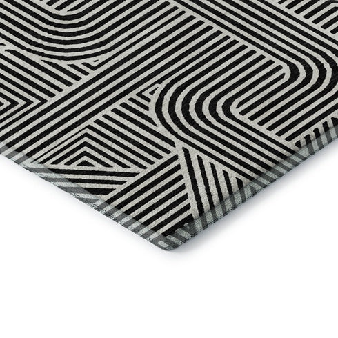 5' X 8' Black And Ivory Abstract Geometric Washable Area Rug With UV Protection