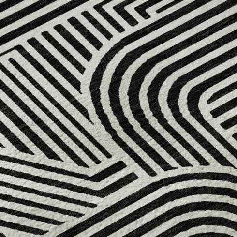 5' X 8' Black And Ivory Abstract Geometric Washable Area Rug With UV Protection