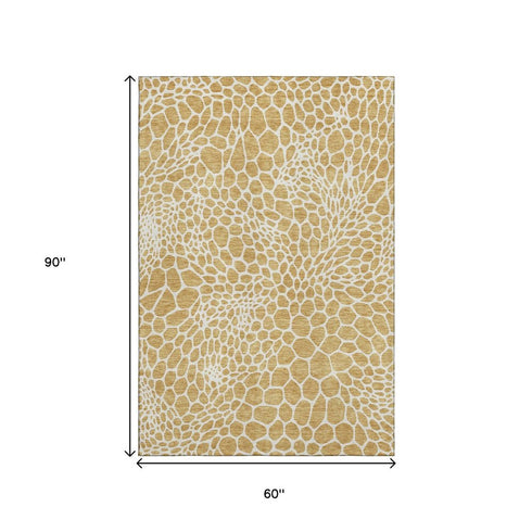 5' X 8' Gold And Ivory Geometric Washable Area Rug With UV Protection
