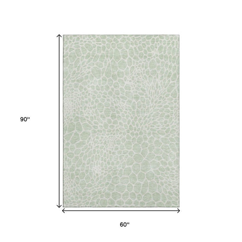5' X 8' Mint Green And Ivory Geometric Washable Area Rug With UV Protection
