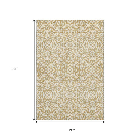 5' X 8' Gold And Ivory Damask Washable Area Rug With UV Protection