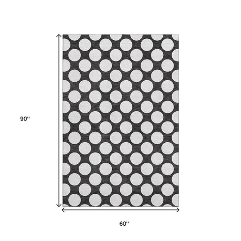 5' X 8' Black And White Polka Dot Washable Area Rug With UV Protection