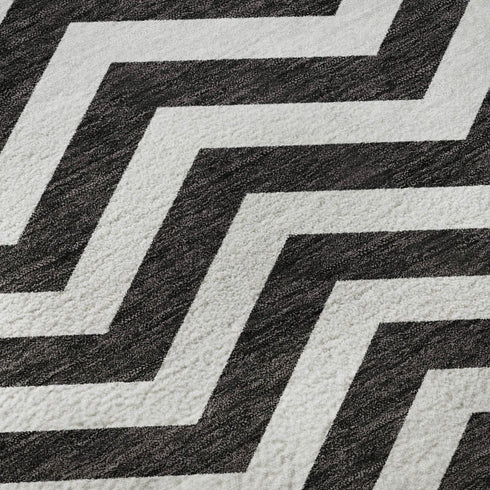 5' X 8' Black And Ivory Chevron Washable Area Rug With UV Protection