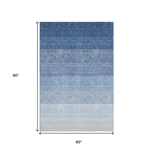 5' X 8' Blue And Ivory Ombre Washable Area Rug With UV Protection