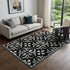 5' X 8' Black And Ivory Floral Washable Area Rug With UV Protection
