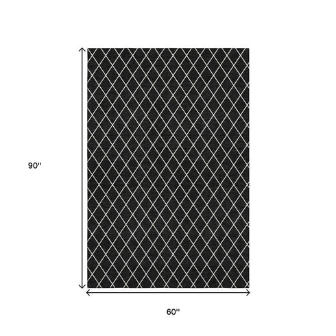 5' X 8' Black And Ivory Geometric Washable Area Rug With UV Protection