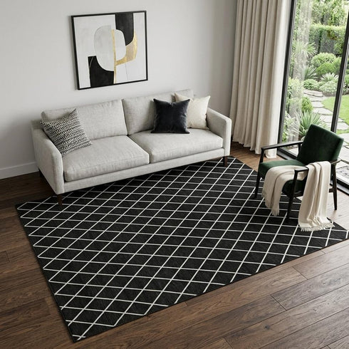 5' X 8' Black And Ivory Geometric Washable Area Rug With UV Protection