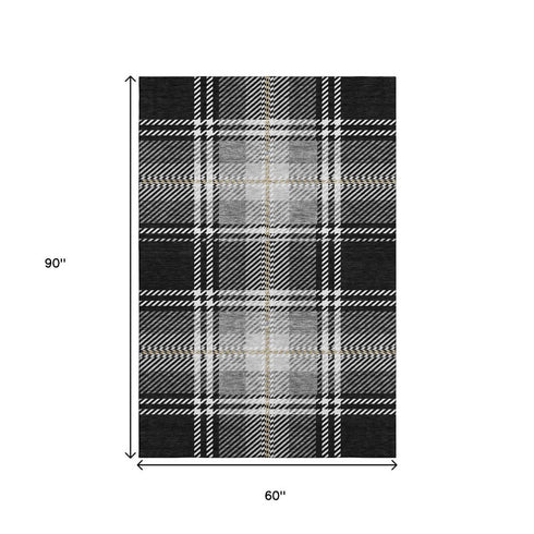 5' X 8' Black Ivory And Gold Plaid Washable Area Rug With UV Protection