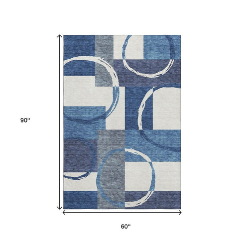 5' X 8' Blue And Ivory Geometric Washable Area Rug With UV Protection