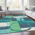 5' X 8' Teal Ivory And Green Geometric Washable Area Rug With UV Protection