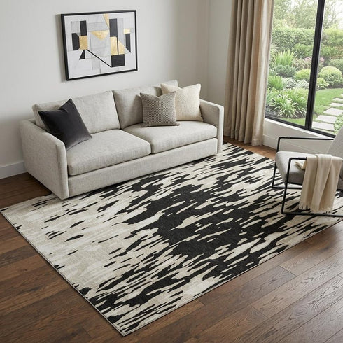 5' X 8' Black And Ivory Abstract Washable Area Rug With UV Protection