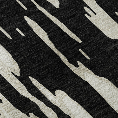 5' X 8' Black And Ivory Abstract Washable Area Rug With UV Protection