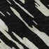 5' X 8' Black And Ivory Abstract Washable Area Rug With UV Protection