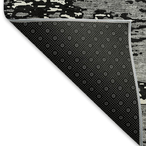 5' X 8' Black And Ivory Abstract Washable Area Rug With UV Protection