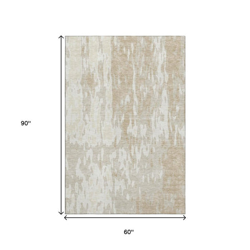 5' X 8' Beige Ivory And Tan Abstract Washable Area Rug With UV Protection