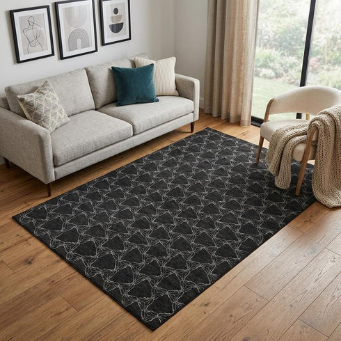 5' X 8' Black And Ivory Geometric Washable Area Rug With UV Protection