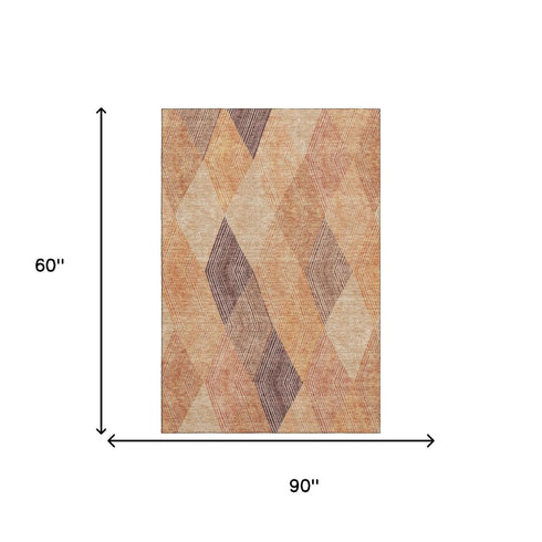 5' X 8' Orange Salmon And Ivory Geometric Washable Area Rug With UV Protection