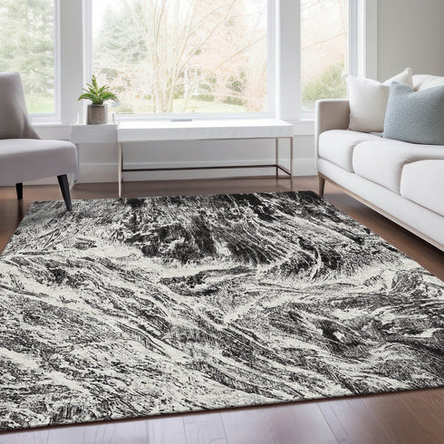 9' X 12' Black And Ivory Abstract Washable Area Rug With UV Protection