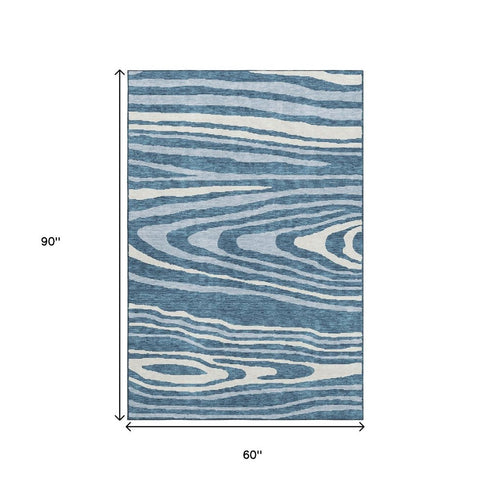 5' X 8' Navy Blue And Ivory Woodland Lodge Washable Area Rug With UV Protection